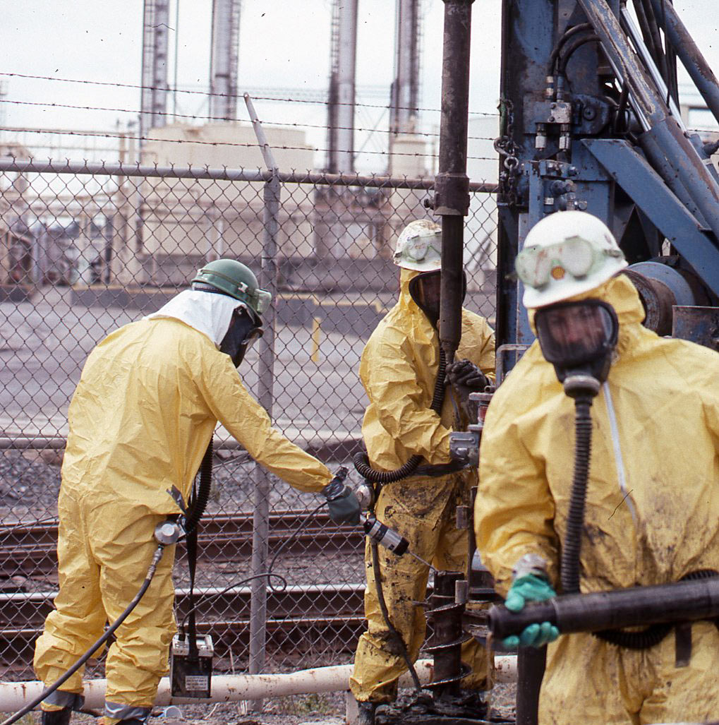 Geologists on Drilling Rig in Level B Protection